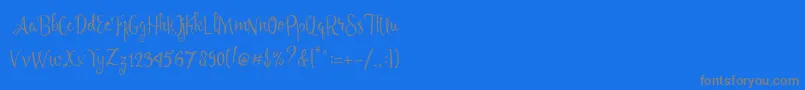 Angelia Script Free Demo-Schriftart – Graue Schriften auf blauem Hintergrund