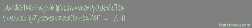 Angelia Script Free Demo Font – Green Fonts on Gray Background