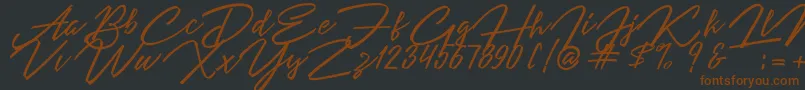 Angelina Script-fontti – ruskeat fontit mustalla taustalla