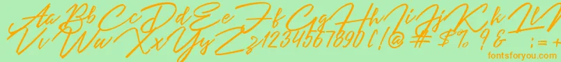 Czcionka Angelina Script – pomarańczowe czcionki na zielonym tle