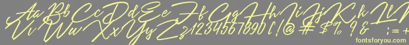 Angelina Script-Schriftart – Gelbe Schriften auf grauem Hintergrund