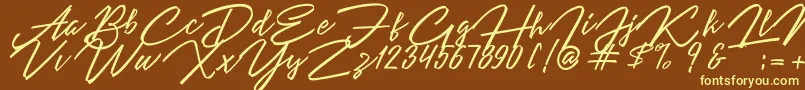 Angelina Script Font – Yellow Fonts on Brown Background