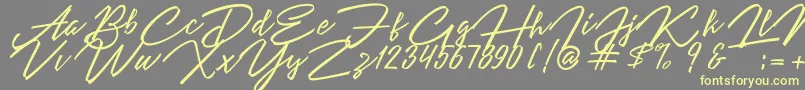 Angelina Script Font – Yellow Fonts on Gray Background
