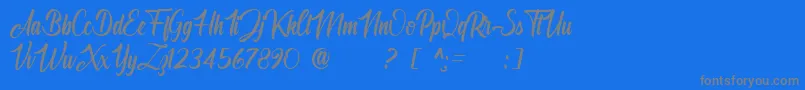 Angelinatta personal use only-Schriftart – Graue Schriften auf blauem Hintergrund