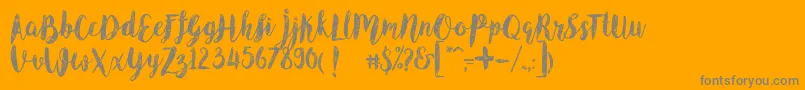 Angeline Vintage Demo-Schriftart – Graue Schriften auf orangefarbenem Hintergrund