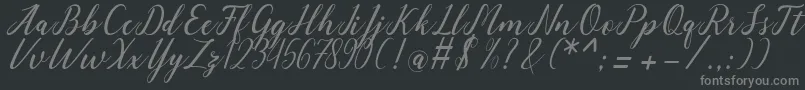 angeline-fontti – harmaat kirjasimet mustalla taustalla