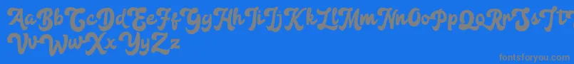 Anggada FREE-Schriftart – Graue Schriften auf blauem Hintergrund