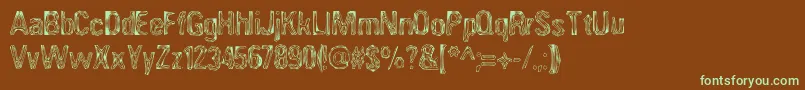 フォントANGIA    – 緑色の文字が茶色の背景にあります。