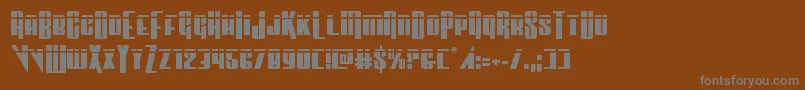 Vindicatorlaser-fontti – harmaat kirjasimet ruskealla taustalla