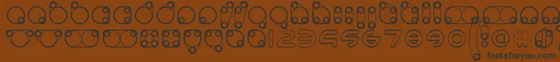 フォントanimoto 2019 04 13 – 黒い文字が茶色の背景にあります