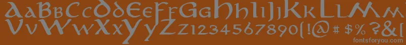 anirm   -fontti – harmaat kirjasimet ruskealla taustalla