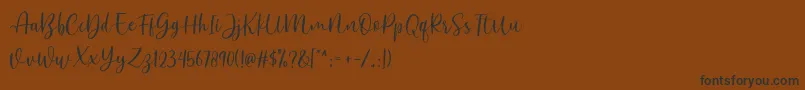 Anjani DEMO Font – Black Fonts on Brown Background