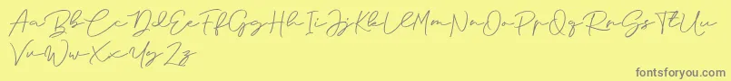 フォントAnjel Signature For Personal Use – 黄色の背景に灰色の文字