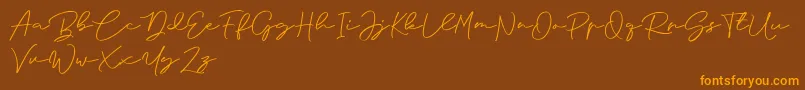 Anjel Signature For Personal Use-Schriftart – Orangefarbene Schriften auf braunem Hintergrund