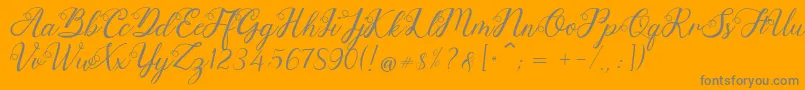 Anjelina-Schriftart – Graue Schriften auf orangefarbenem Hintergrund