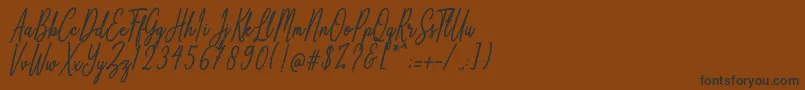 Anthoine-Schriftart – Schwarze Schriften auf braunem Hintergrund