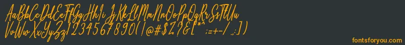 フォントAnthoine – 黒い背景にオレンジの文字