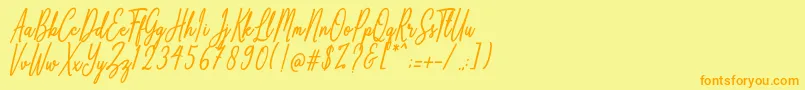 フォントAnthoine – オレンジの文字が黄色の背景にあります。