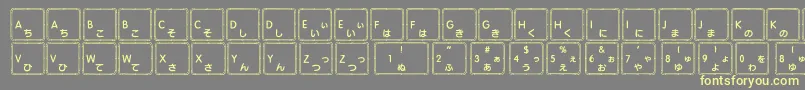 Apple Japanese Keyboard-Schriftart – Gelbe Schriften auf grauem Hintergrund