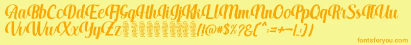 フォントAprilea – オレンジの文字が黄色の背景にあります。