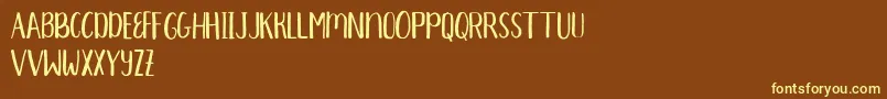 Aprils Demo Font – Yellow Fonts on Brown Background