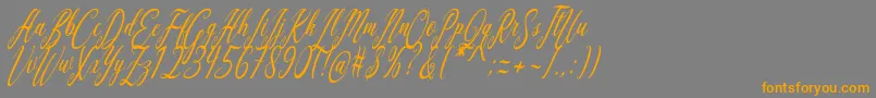 Czcionka Aquilera Script – pomarańczowe czcionki na szarym tle