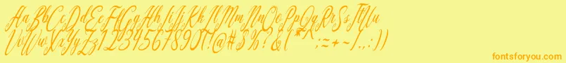 フォントAquilera Script – オレンジの文字が黄色の背景にあります。