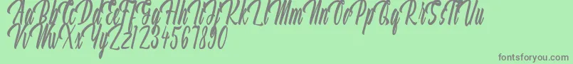 Aquilland Font – Gray Fonts on Green Background
