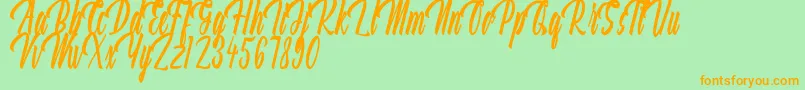 Aquilland Font – Orange Fonts on Green Background