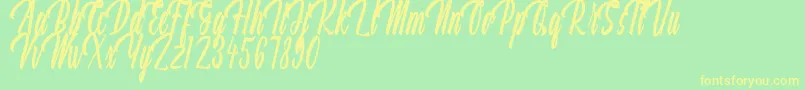 Aquilland Font – Yellow Fonts on Green Background