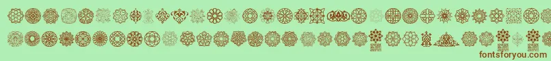 Arabesque Ornaments Font – Brown Fonts on Green Background