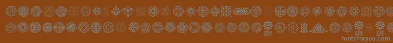 Arabesque Ornaments Font – Gray Fonts on Brown Background