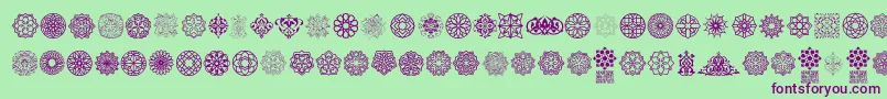 Arabesque Ornaments-Schriftart – Violette Schriften auf grünem Hintergrund