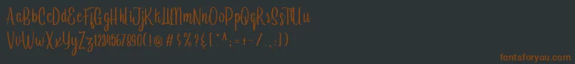 Шрифт Arayara demo – коричневые шрифты на чёрном фоне