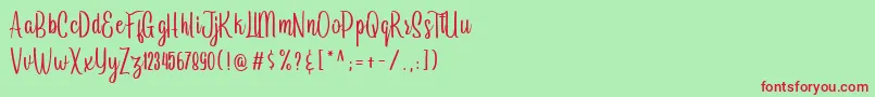 Arayara demo-Schriftart – Rote Schriften auf grünem Hintergrund
