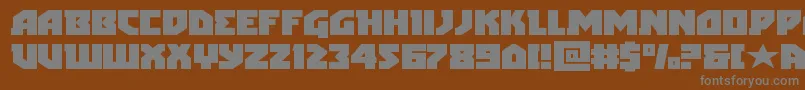 arcticguardianexpand-fontti – harmaat kirjasimet ruskealla taustalla