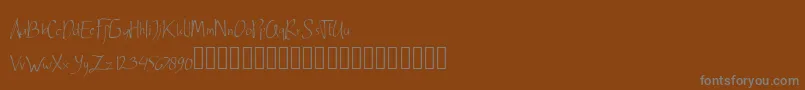 Ardnerandemo-Schriftart – Graue Schriften auf braunem Hintergrund