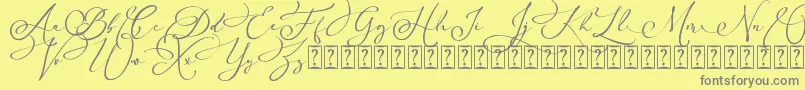Arellia Script Dafont-Schriftart – Graue Schriften auf gelbem Hintergrund