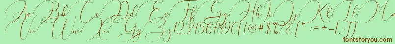 Fonte Argentina Script – fontes marrons em um fundo verde