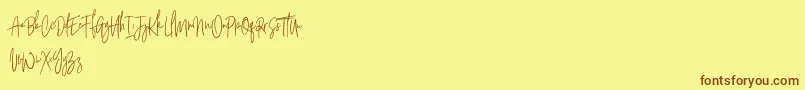 フォントArgents Free – 茶色の文字が黄色の背景にあります。