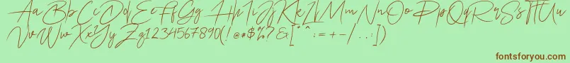 フォントAriel Script – 緑の背景に茶色のフォント