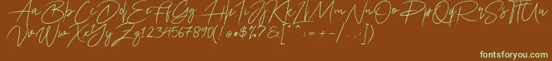 フォントAriel Script – 緑色の文字が茶色の背景にあります。