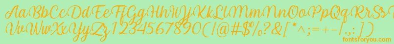 Czcionka Arinda Font by 7NTypes – pomarańczowe czcionki na zielonym tle