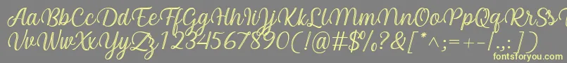 Arinda Font by 7NTypes-fontti – keltaiset fontit harmaalla taustalla