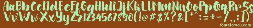 フォントarinda – 緑色の文字が茶色の背景にあります。