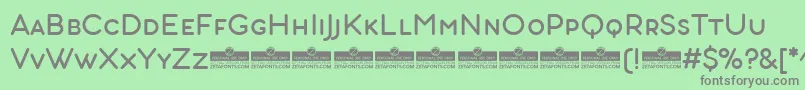 AristotelicaSmallCaps Regular-fontti – harmaat kirjasimet vihreällä taustalla