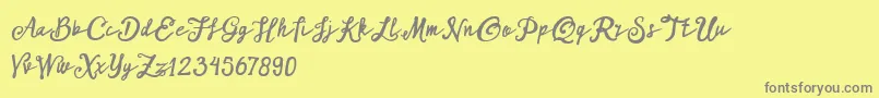 ARKMishaDemo Script-fontti – harmaat kirjasimet keltaisella taustalla