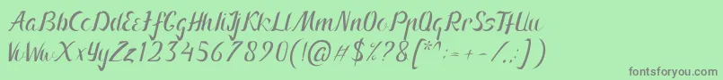 Arnietty-Schriftart – Graue Schriften auf grünem Hintergrund