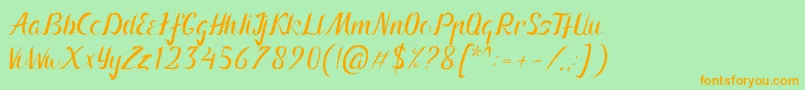 フォントArnietty – オレンジの文字が緑の背景にあります。