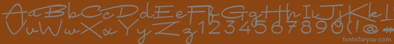 フォントArsokiela Regular – 茶色の背景に灰色の文字